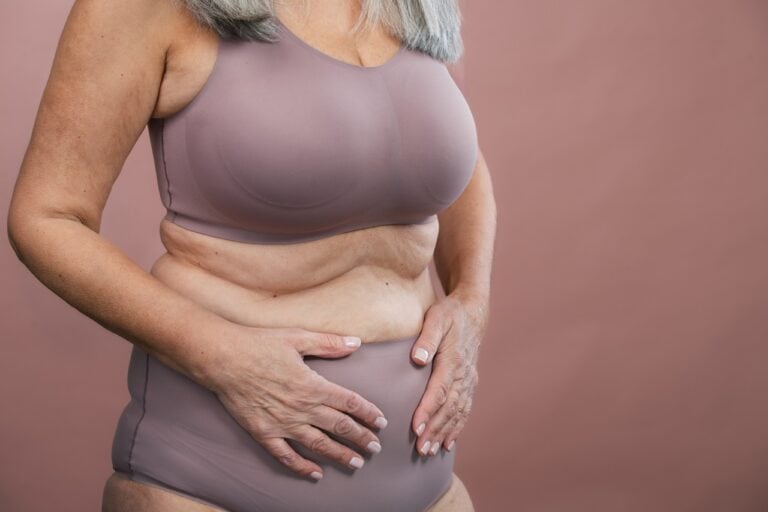 senior woman with grey hair in underwear