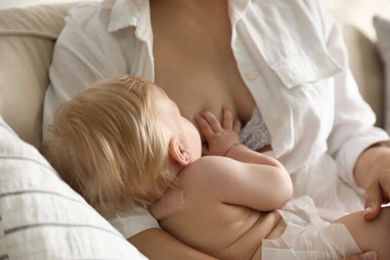 mom breastfeeding baby boy